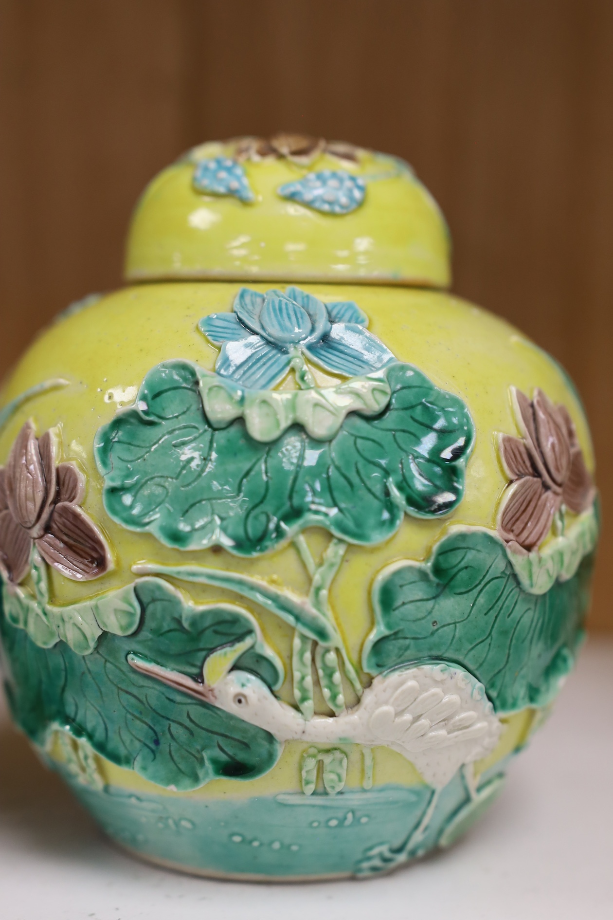 A Chinese polychrome glazed jar and cover, a Wangbinrong mark and a Japanese jar, jar and cover 14.5cm high. Condition - good